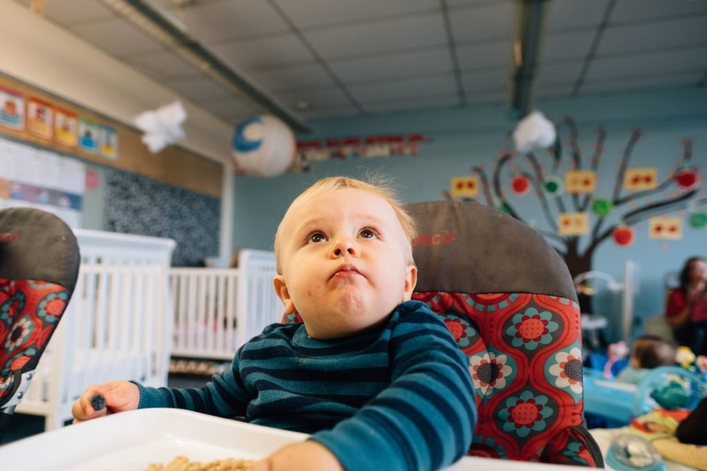 Picture: A young baby looks up at the camera.